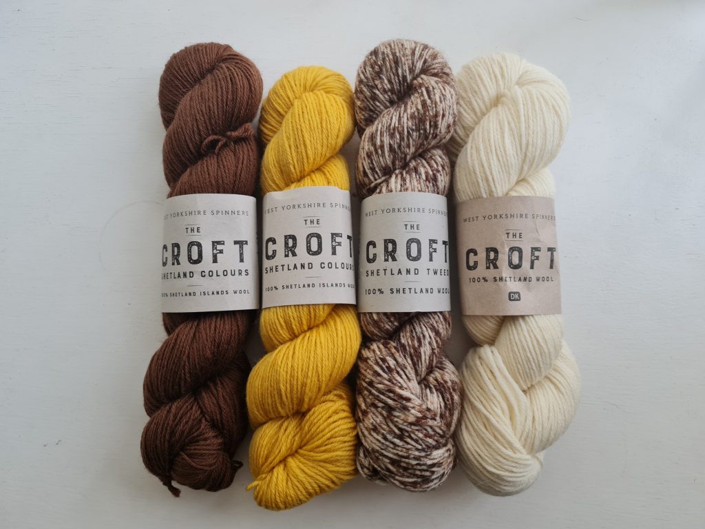 A picture of four skeins of the yarn The Croft double knit by West Yorkshire Spinners in the colours Burnside, Harkland, Langa and Burrastow.
