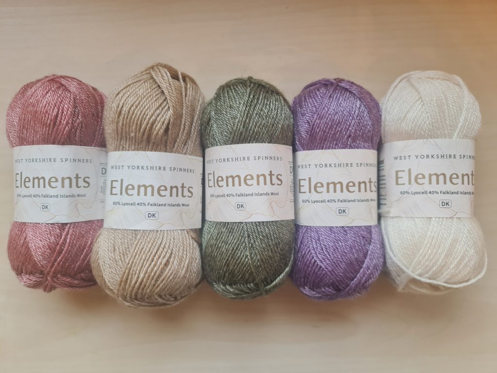 A picture of three hanks of the yarn Elements double knit by West Yorkshire Spinners in the colours Cherry Blossom, Golden Sands, Olive Grove, French Lavender and Oyster Pearl.